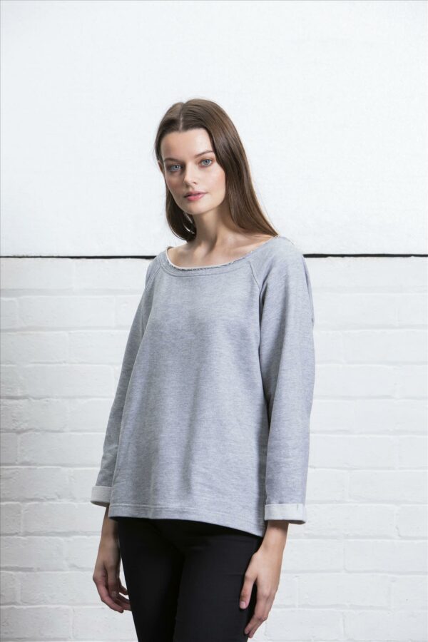 off the shoulder raw edge neckline. 3/4 length roll-up sleeves. Straight open hem. Tear out label."