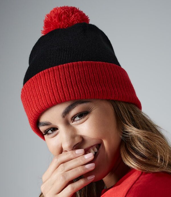 Double layer knit. Dual style - cuffed or slouch. Ribbed cuff. Contrast pom pom and cuff.