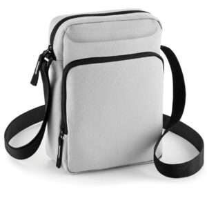 Adjustable webbing strap. Main zip compartment. Front zip pocket. iPad mini™/Tablet compatible. Tear out label. Capacity 1.5 litres.