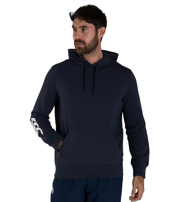 Drop shoulder style. Jersey lined hood with self colour drawcord. Forward facing shoulder seams. Front pouch pocket. Ribbed cuffs and hem. Branding on lower right sleeve.