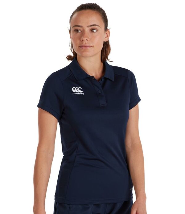 Vapodri wicking technology. Ribbed collar. Two self colour button placket. Mesh back panel. Forward shoulder seams. Offset side seams. Branding on right chest and lower left hem.