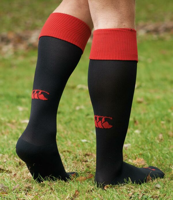 Knee high with rib opening. Contrast turnover. Hard wearing with a comfortable cushioned foot. Branding on back of leg.