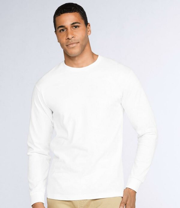 Seamless ribbed collar. Taped neck and shoulders. Tubular body. Ribbed cuffs. Twin needle hem. Tear out label.