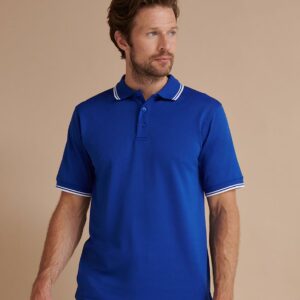 Performance wicking fabric draws moisture away from skin to keep you cool and dry. Easy care fabric. Flat knit collar and cuffs with contrast tipping. Contrast taped neck and side vents. Locker patch. Three self colour button placket. Twin needle stitching.