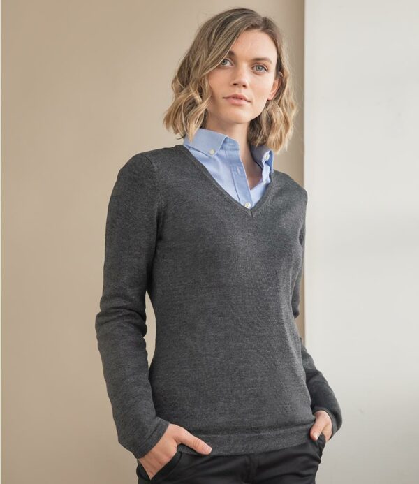 12 gauge. Set in sleeves. Semi-fashioned sleeve and neck detail. 1x1 ribbed neck. Tube knit cuffs and hem.