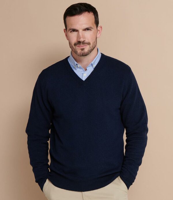 "Woolmark® approved lambswool. 9 gauge. Set in sleeves. Semi-fashioned sleeve and neck detail. 1x1 ribbed neck