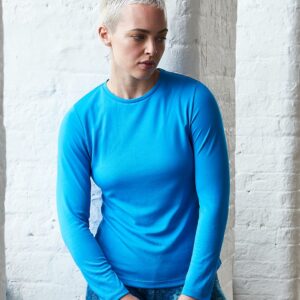 Neoteric™ textured fabric with inherent wickability. UPF 40+ UV protection. Relaxed ladies fit. Self fabric collar. Taped neck. Twin needle stitching. Tear out label.