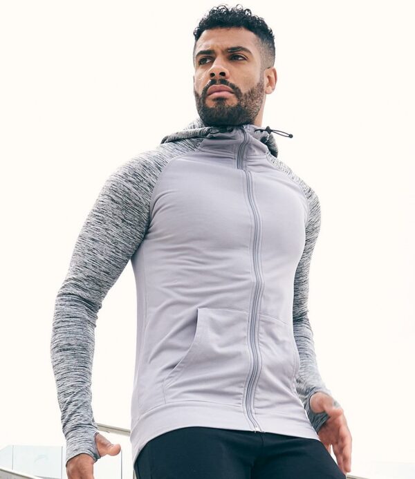 Hood and sleeves 92% polyester/8% elastane. DynamicCool™ responsive blended fabric. Contrast melange effect grown on adjustable hood and raglan sleeves. Taped neck. Full length zip. Front pouch pockets. Thumbholes on cuffs. Tear out label.