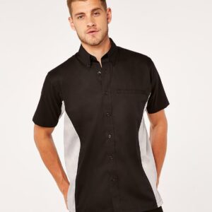 Easy iron fabric. Button down collar with contrast inner. Left vent chest pocket. Back yoke. Contrast side and underarm panels with contrast piping. Contrast taped side vents. Straight hem.