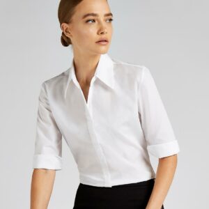 Easy iron fabric.Fused stand up collar.Fitted style with bust and back darts.Pearlised buttons.Concealed placket.3/4 length sleeves with cuff vent.Side vents.Curved hem.