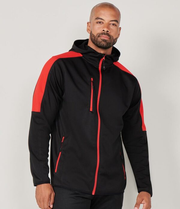 Soft jersey fabric with bonded micro fleece reverse. Three panel hood. Contrast shoulders and upper sleeve panels. Full length contrast zip with non-slip gripper zip pulls. Contrast right chest and two front zip pockets. Top stitched side panels. Stretch bound cuffs and hem. Drop hem.
