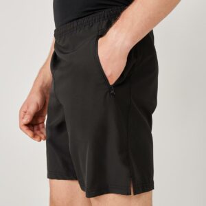 Unlined. Elasticated waistband with inner drawcord. Two side zip pockets. Centre rear zip pocket with mesh pocket bag.