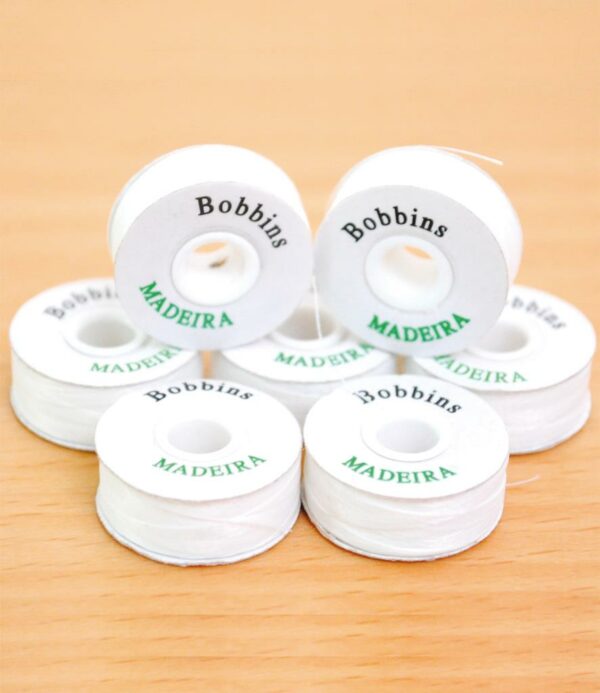 "Ready to use. The same amount of thread on each bobbin