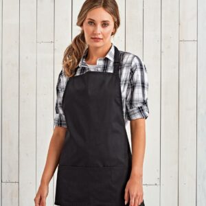 Easy care fabric.Three pocket short bib apron.Self fabric neck tie with adjustable buckle.Doubled over