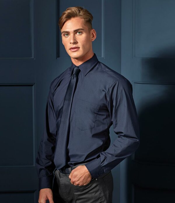 Easy care fabric.Stiffened collar.Left chest pocket.Self colour buttons.Back yoke.Adjustable cuffs with option for cuff links.Straight hem.Available in short sleeve PR202.