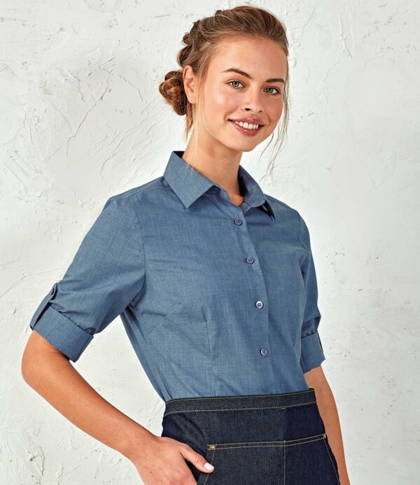 Easy care textured fabric. Fitted style. Soft collar. Self colour buttons. Back yoke. Front and back darts. Roll-up sleeves with button and tab. Two button cuffs. Curved hem.