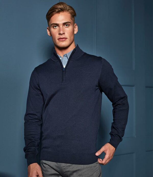 12 gauge. Fine knit. Easy care. Soft feel. Set in sleeves. Zip neck. Ribbed cuffs and hem.
