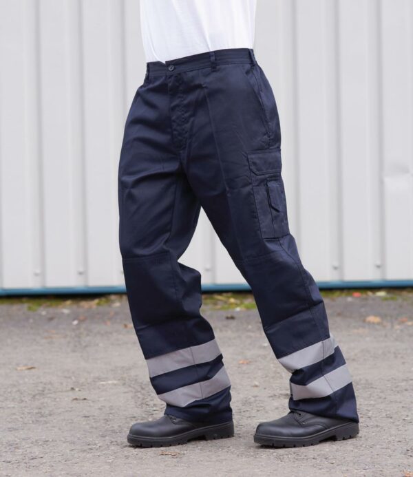 UPF 50+.Elasticated back waistband with belt loops.Zip fly with button over.Two hip pockets.Rear jetted pocket with button closure.Right leg ruler pocket.Left leg tear release patch pocket and media pocket.Knee pad pockets.Reflective bands at lower leg.Branding above right rear pocket.