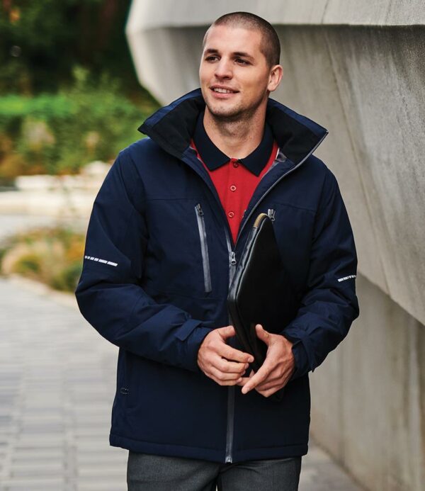 Lightweight polyester lining. Thermo-Reflect lining panel for heat retention. Thermo-Guard® insulation. Conforms to EN343: 2003 A1: 2007 class 3:2. Waterproof with taped seams. Windproof and breathable. Concealed adjustable hood. Warm touch scrim lined collar. Full length waterproof zip with chin guard and inner zip guard. Two waterproof chest zip pockets. RFID pocket protection. Reflective detail on sleeves. Two front zip pockets. Tear release adjustable cuffs with inner storm cuffs. Drawcord hem. Cut out label. Access for decoration.