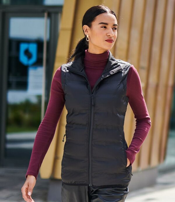 "Polyester lining. Warmloft insulation. Showerproof and windproof. Welded seams. Full length zip with chin guard and inner zip guard. Two front zip pockets. Stretch bound collar