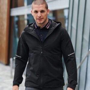 Woven stretch polyester outer with a soft reverse. Showerproof and breathable. Quick drying and moisture wicking. Grown on technical adjustable hood. Full length zip with chin guard and inner zip guard. Two front zip pockets. Tear release adjustable cuffs. Drawcord hem. Reflective detail on sleeves and centre back hem. Cut out label.