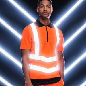 Conforms to EN ISO 20471: 2013 + A1: 2016 class 2. RIS-3279-TOM (orange/navy only). Quick drying with natural wicking properties. Contrast ribbed collar. Black zip neck. Two angled ID reflective tape bands around the body and one over each shoulder. Twin needle stitching. Cut out label.
