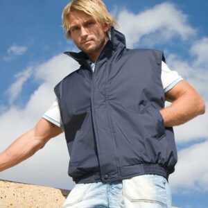 Polyester quilted lining. Showerproof and windproof. Collar high full length zip with storm flap. Two front pockets. Inner pocket. Partially elasticated hem. Cut out label.
