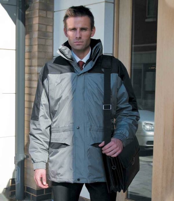"Polyester lining. Polyester padding. Waterproof 2000mm with taped seams. Windproof. Main jacket has a concealed adjustable lined hood. Full length two way zip with stud and tear release storm flap. Various pockets including two deep front