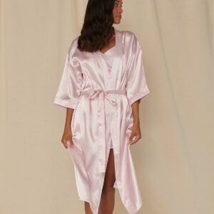 Kimono style robe. 3/4 length sleeves. Self fabric tie front. Side pockets. Below knee length. Tear out label. Suitable for sublimation printing.