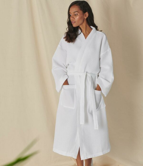 Lightweight fabric. Kimono style robe. Two patch pockets. Tie front. Hanging loop.
