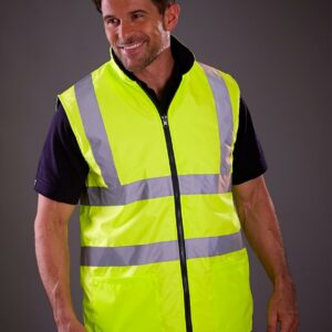 Conforms to EN ISO 20471: 2013 + A1: 2016 class 2. RIS-3279-TOM (orange only). Lightweight. Collar high full length zip. Two reflective bands around the body and one over each shoulder. Two handwarmer pockets on both sides. Inner pocket. Tear release access for decoration.
