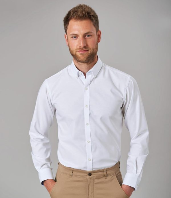 Tailored fit.Button down collar.Contrast inner collar and cuffs.Clear buttons.Back yoke with locker loop.Pleated back panel.Two button adjustable cuffs with button on cuff gauntlet.Curved hem.